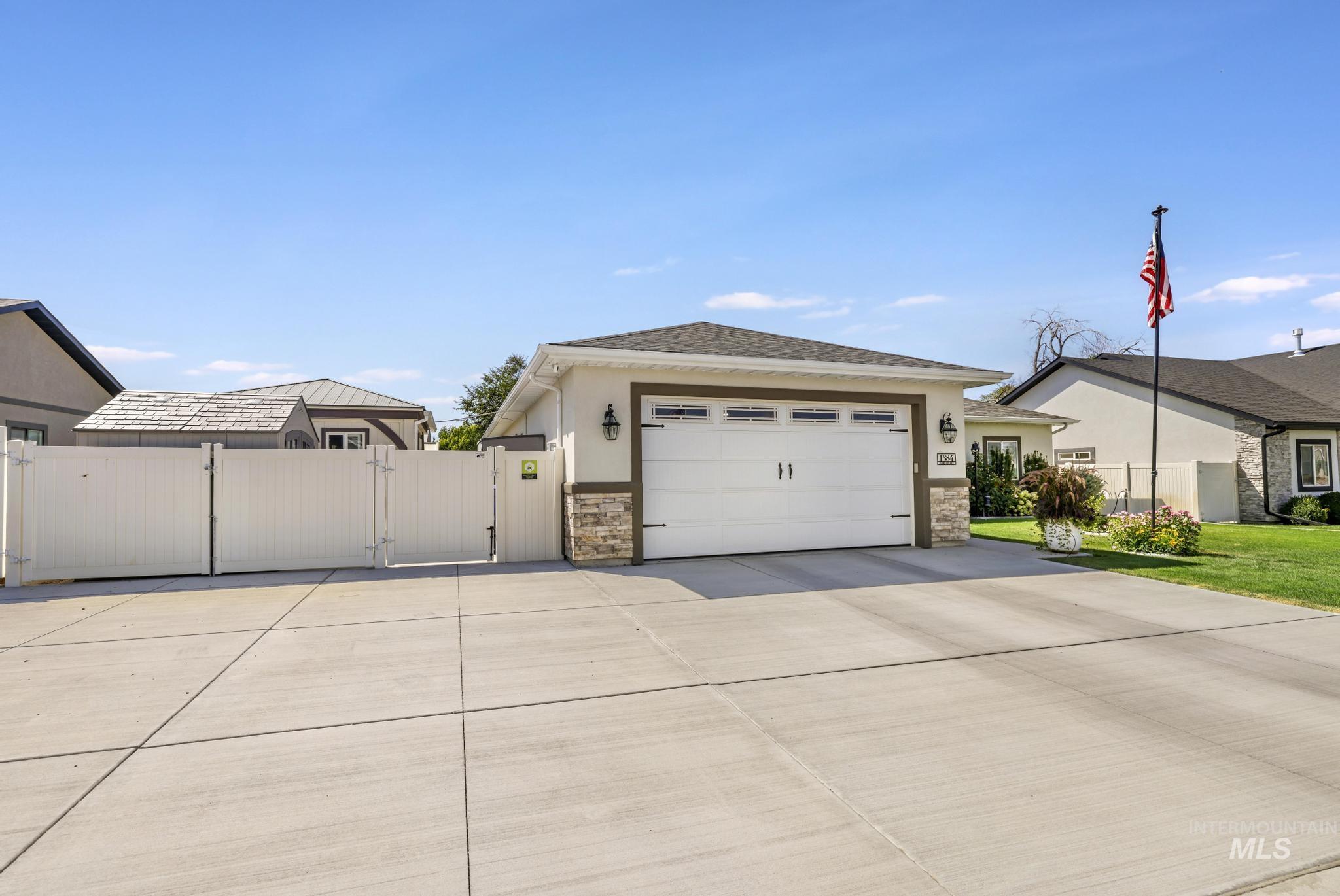 1384 Jump Street Twin Falls, ID 83301 - Photo 33 of 37 Garage with a gate and driveway