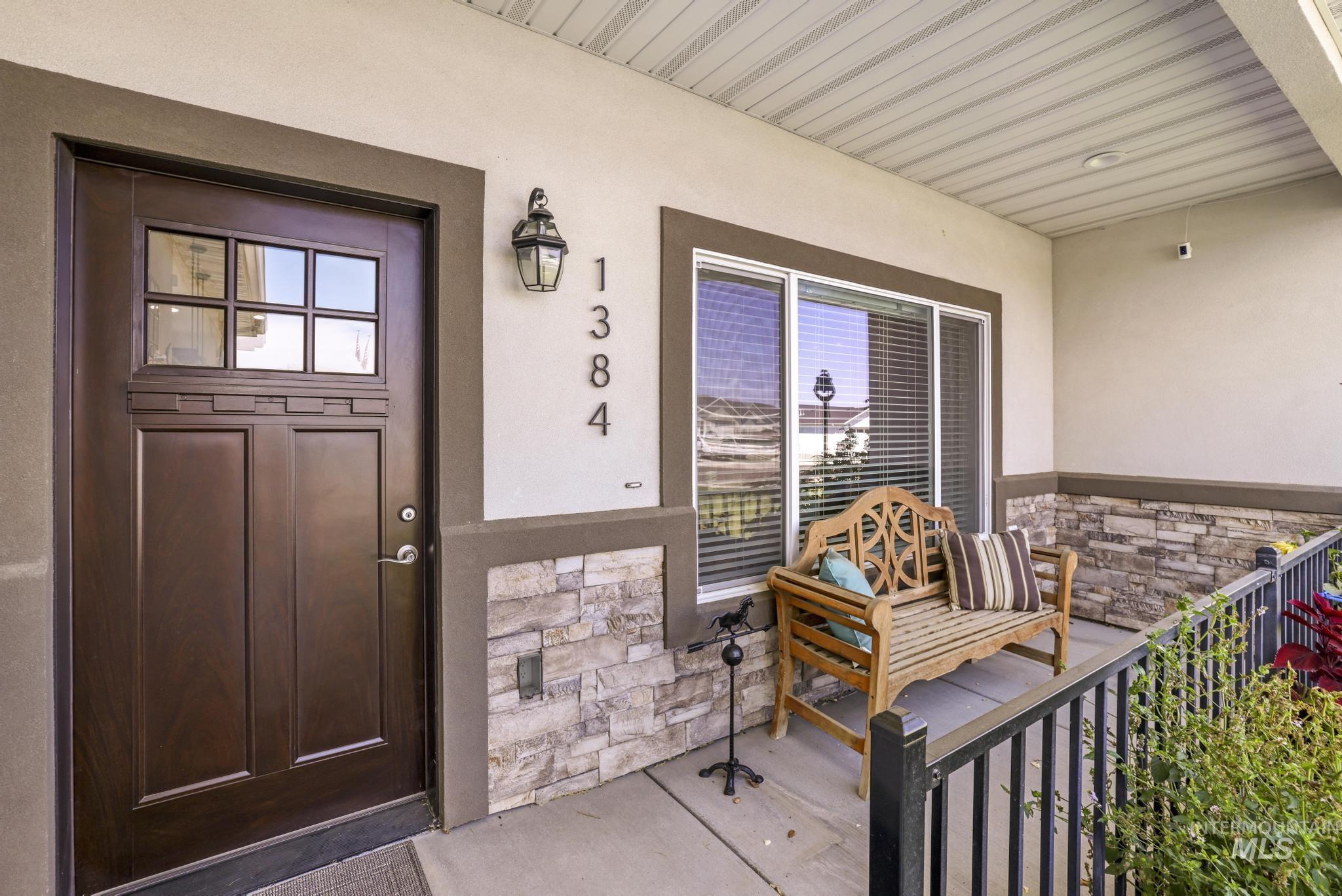 1384 Jump Street Twin Falls, ID 83301 - Photo 4 of 37 Property entrance featuring stone siding, stucco siding, and covered porch