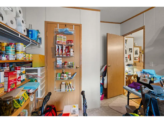 a kitchen with stainless steel appliances a stove a sink dishwasher and cabinets with wooden floor