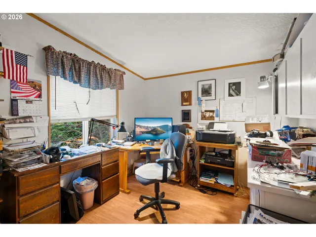 a bathroom with a sink mirror and vanity