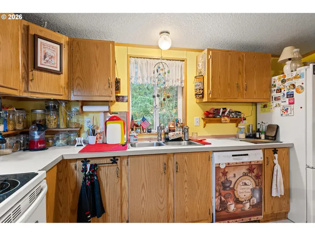 a kitchen that has a lot of cabinets in it
