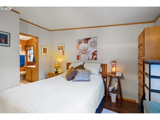 a bedroom with furniture and a chandelier
