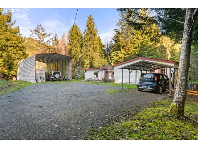 a view of house with backyard and seating space
