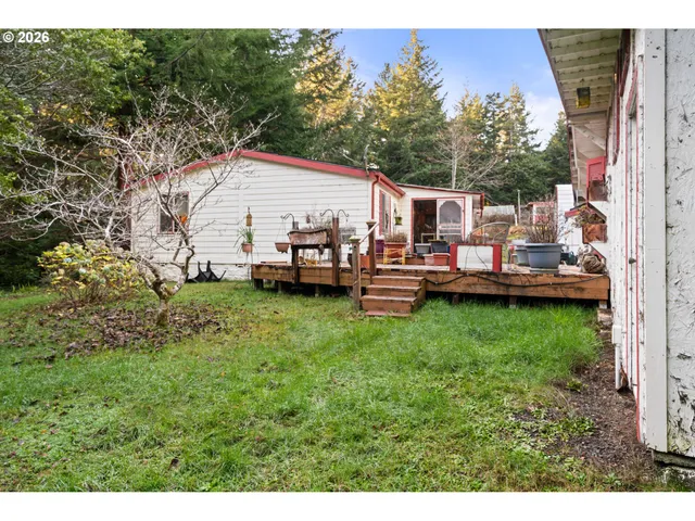 a aerial view of a house with a yard deck and a slide