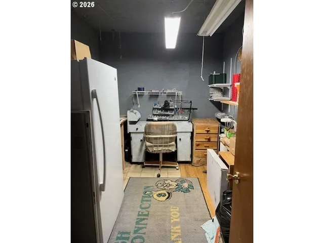 a kitchen with refrigerator and stove