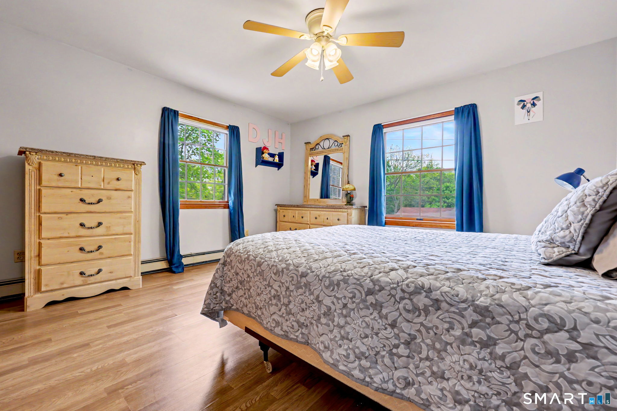 7 Merrill Road Trumbull, CT 06611 - Photo 27 of 40 a bedroom with a bed and a dresser next to a window