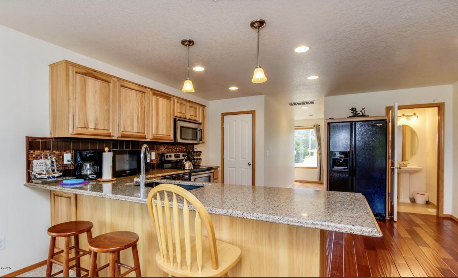 5777 Logan Road Lincoln City, OR 97367 - Photo 9 of 30 Granite & Hickory Kitchen