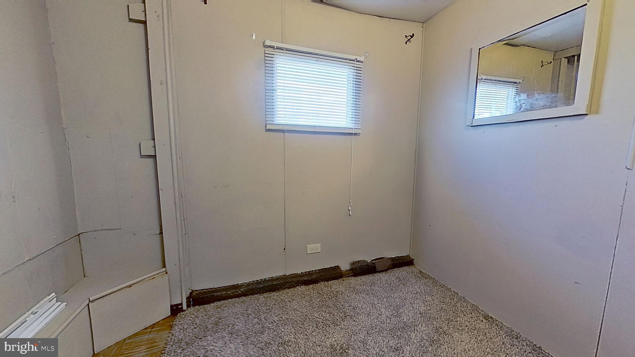 3230 Oakland Road, Unit 13 Dover, PA 17315 - Photo 7 of 7 an empty room with windows and closet