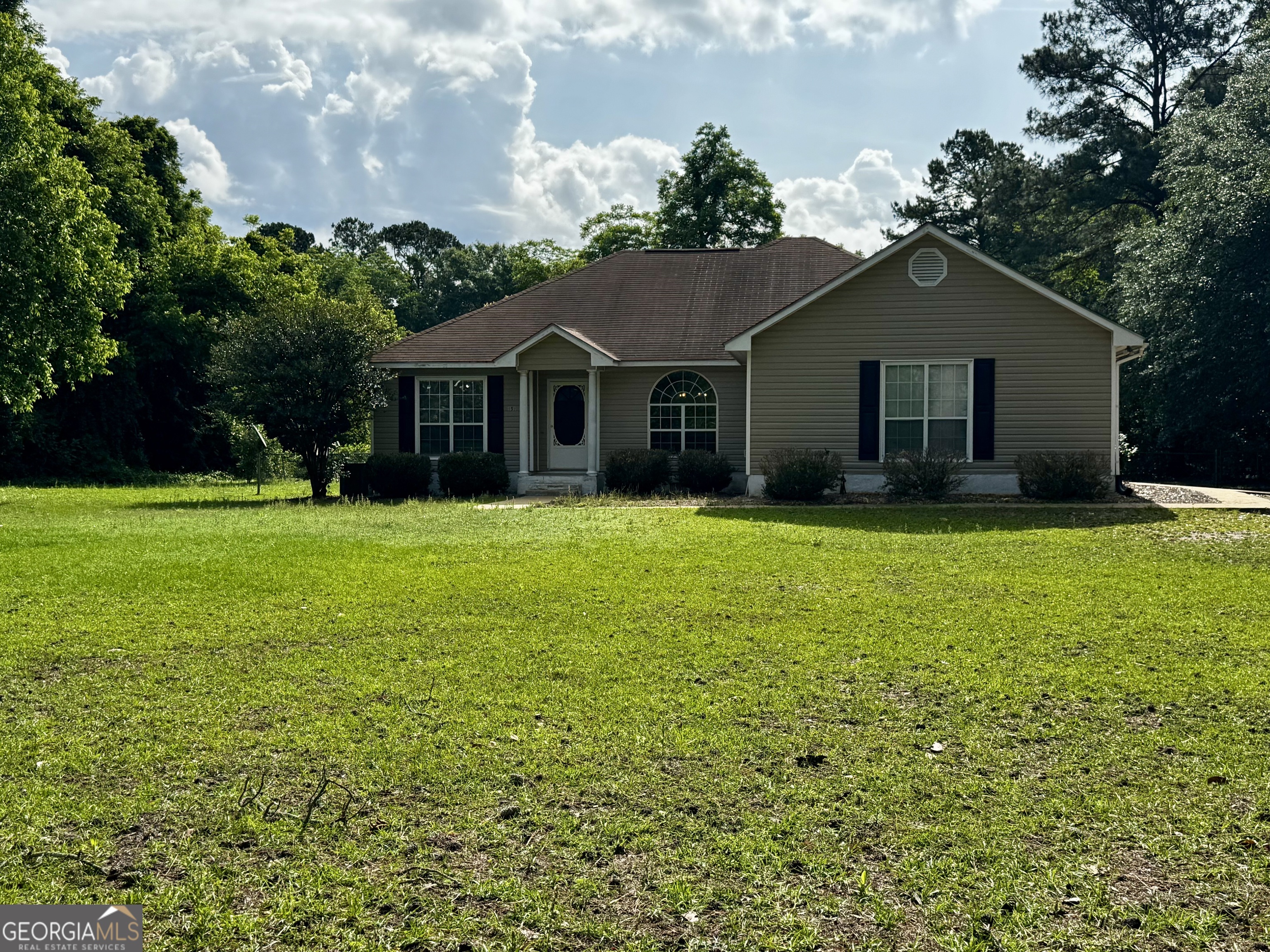 959 Lovers Lane Road Leesburg, GA 31763 - Photo 2 of 19 a house view with a garden space