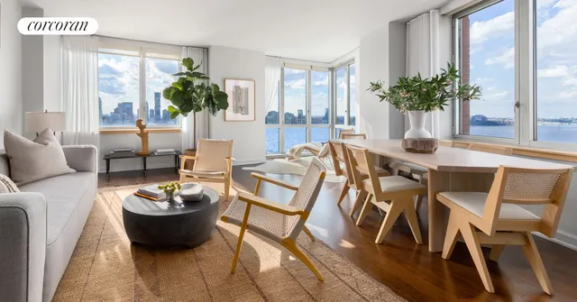 a view of a dining room with furniture and window