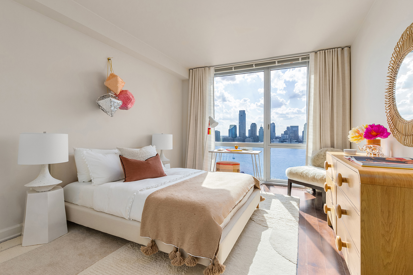 20 River Terrace, Unit 26B Manhattan, NY 10282 - Photo 19 of 25 a bedroom with a bed and a large window