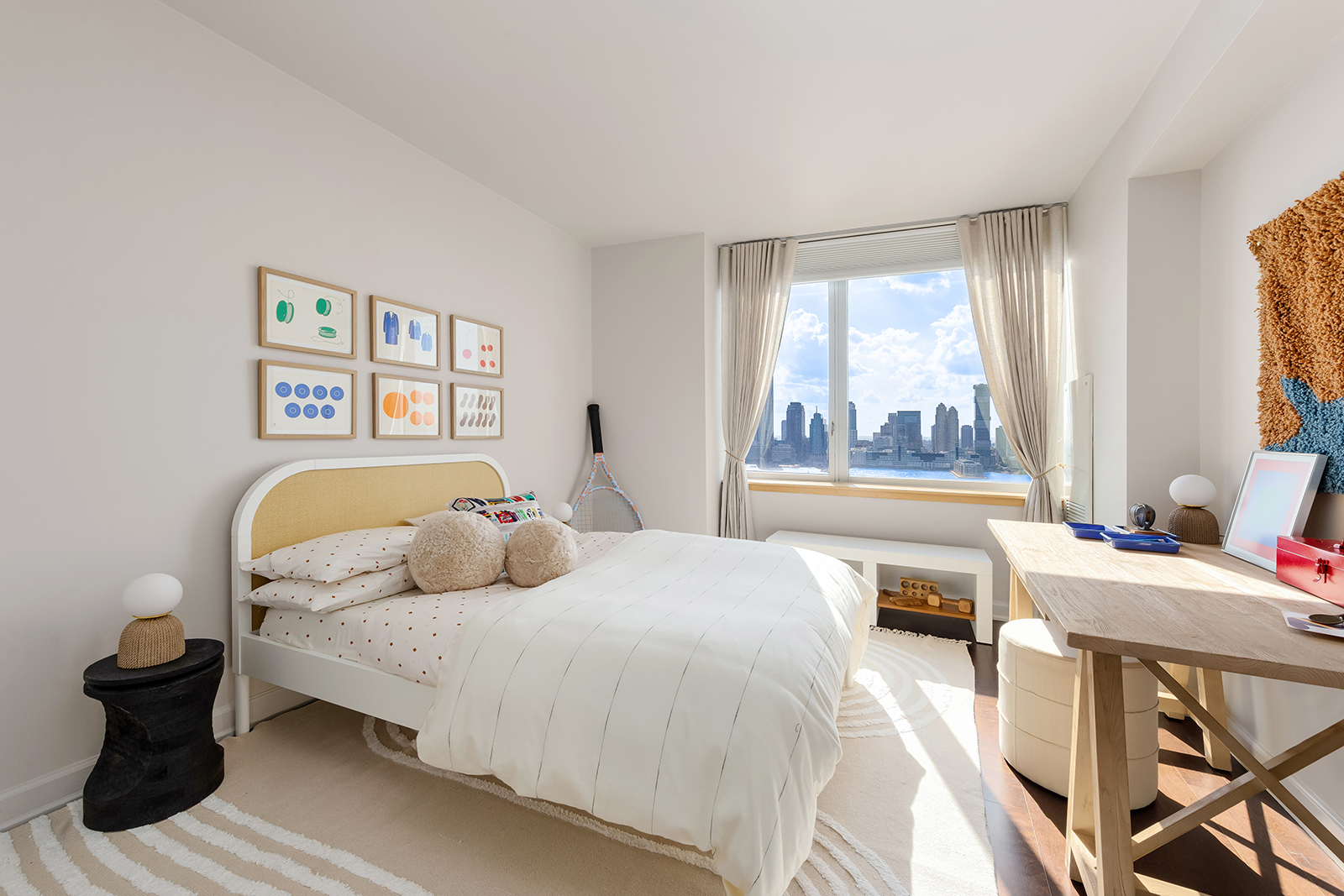 20 River Terrace, Unit 26B Manhattan, NY 10282 - Photo 21 of 25 a bedroom with a bed and a large window