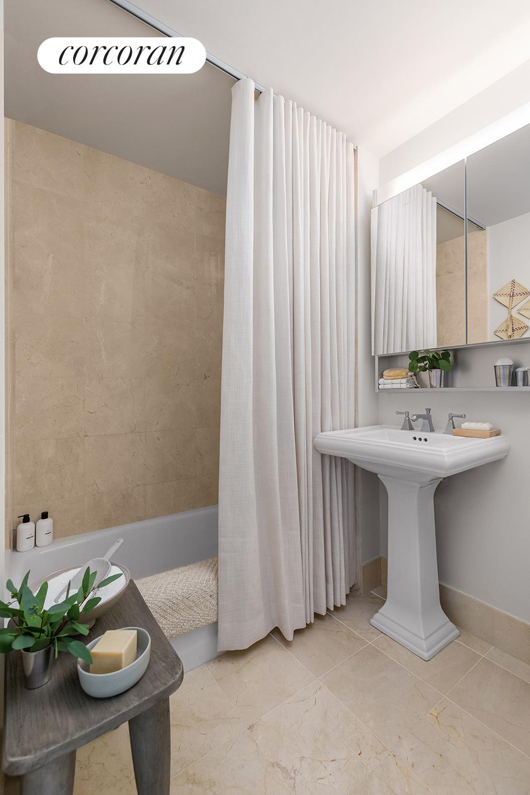 20 River Terrace, Unit 26B Manhattan, NY 10282 - Photo 8 of 25 a bathroom with a sink and a mirror