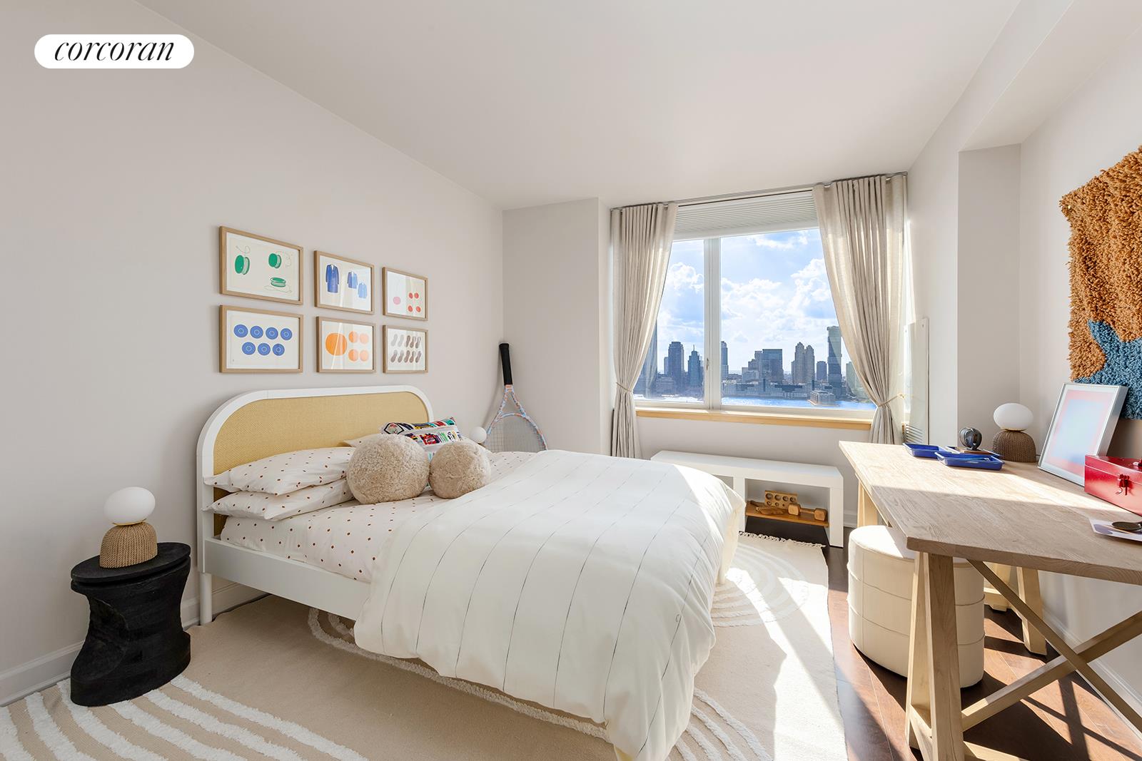 20 River Terrace, Unit 26B Manhattan, NY 10282 - Photo 9 of 25 a bedroom with a bed and a large window
