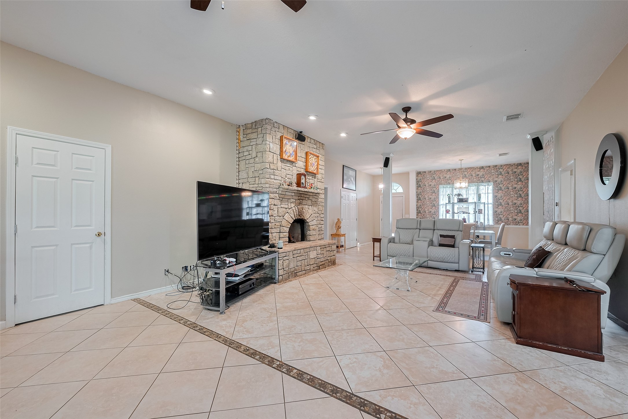 2499 Southline Road Conroe, TX 77384 - Photo 11 of 48 a living room with furniture and a flat screen tv