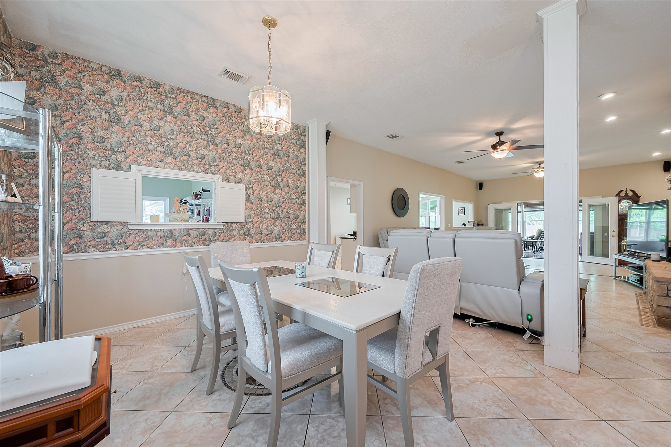 2499 Southline Road Conroe, TX 77384 - Photo 13 of 48 a view of a dining room with furniture and a chandelier