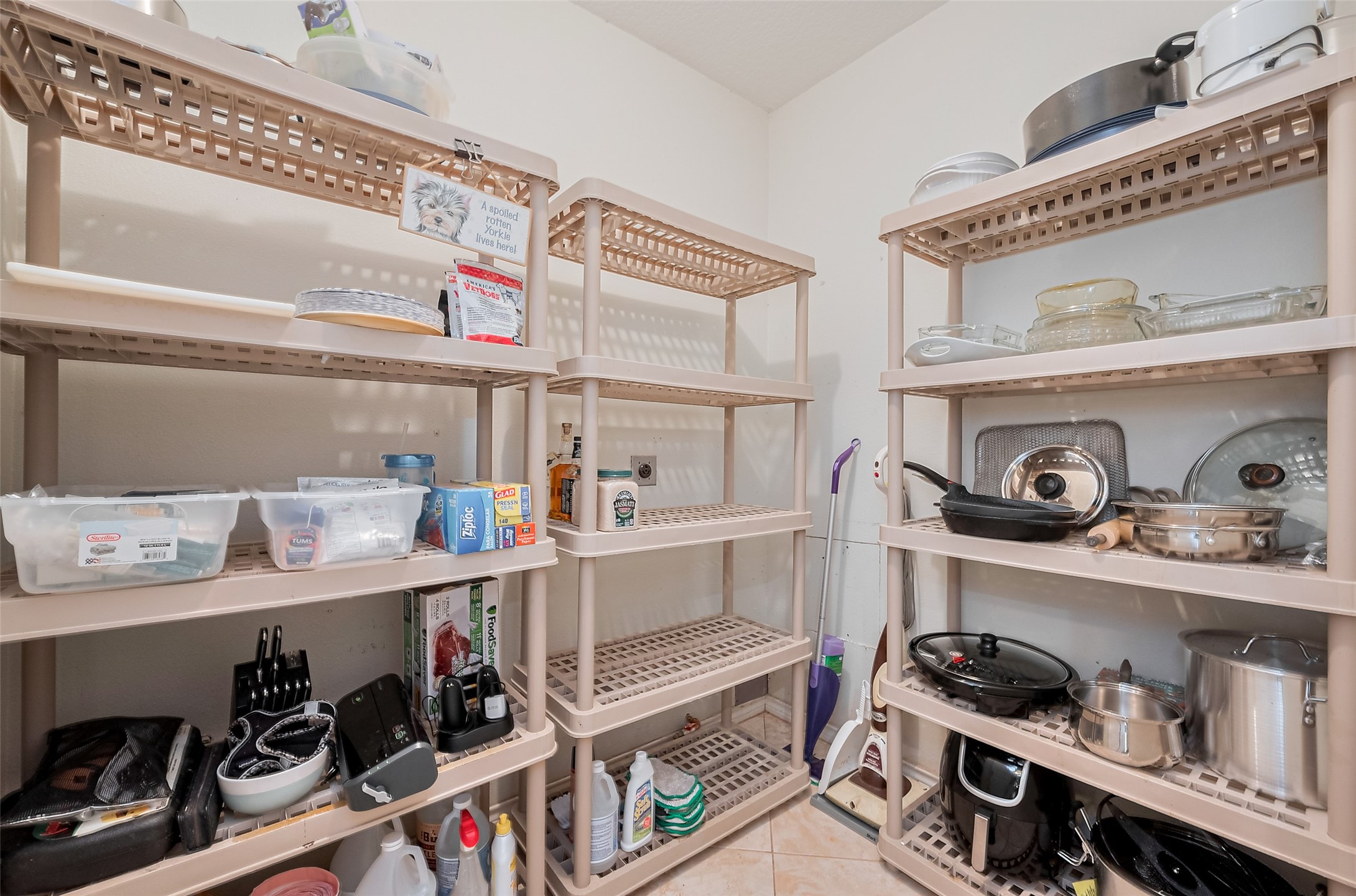 2499 Southline Road Conroe, TX 77384 - Photo 24 of 48 a kitchen with lots of clutter and cabinets