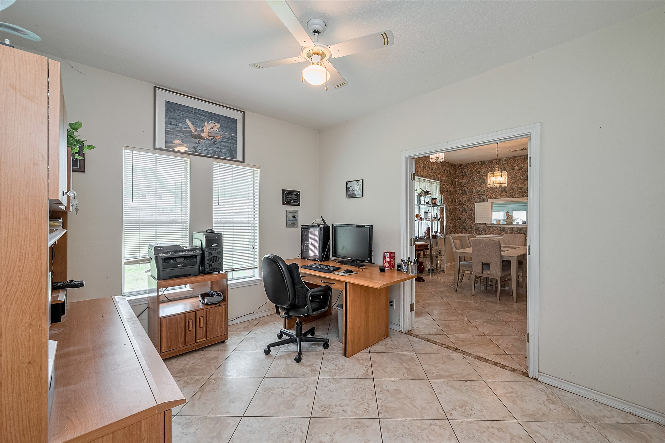 2499 Southline Road Conroe, TX 77384 - Photo 26 of 48 a view of a workspace with furniture and a livingroom