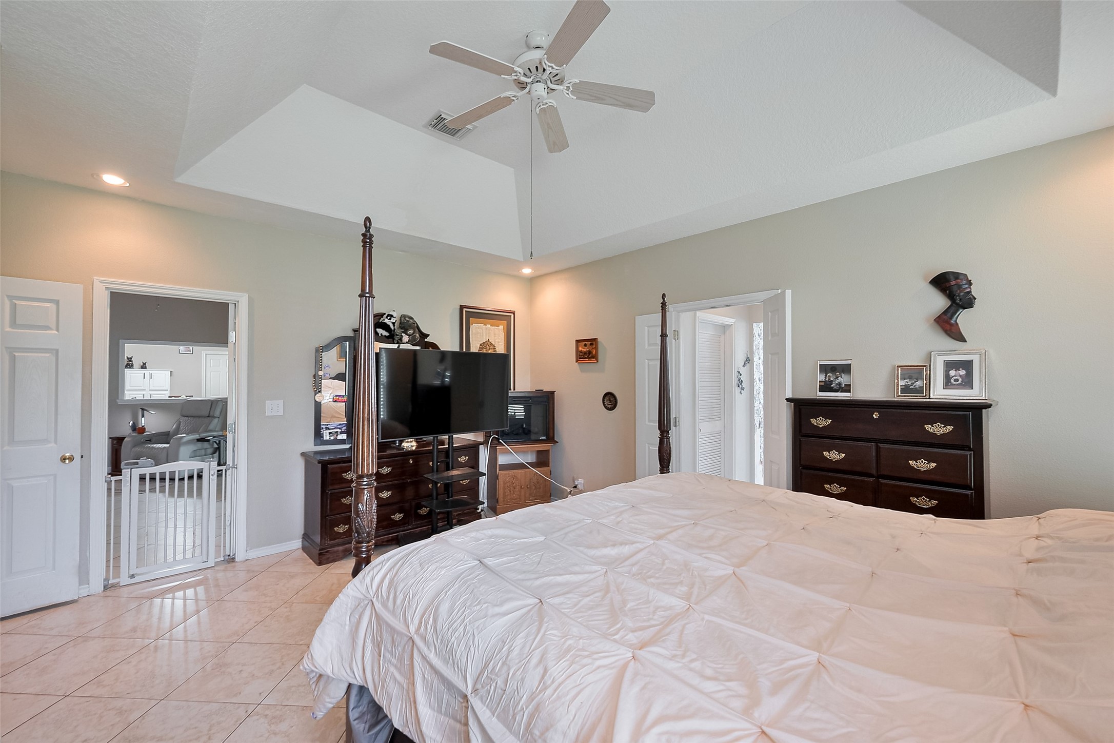 2499 Southline Road Conroe, TX 77384 - Photo 36 of 48 a bedroom with a bed and a flat tv screen