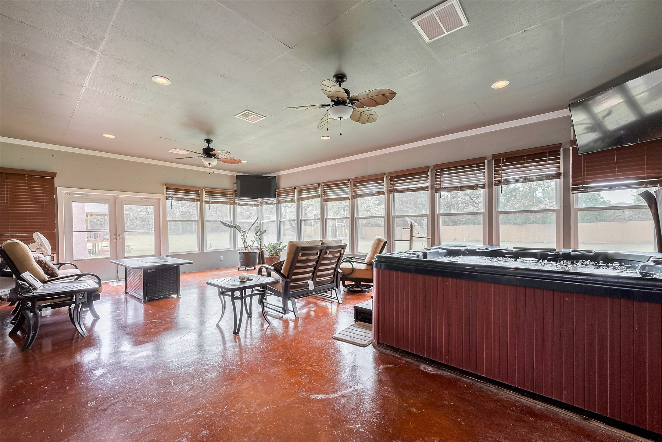 2499 Southline Road Conroe, TX 77384 - Photo 41 of 48 a living room with furniture large window and flat screen tv