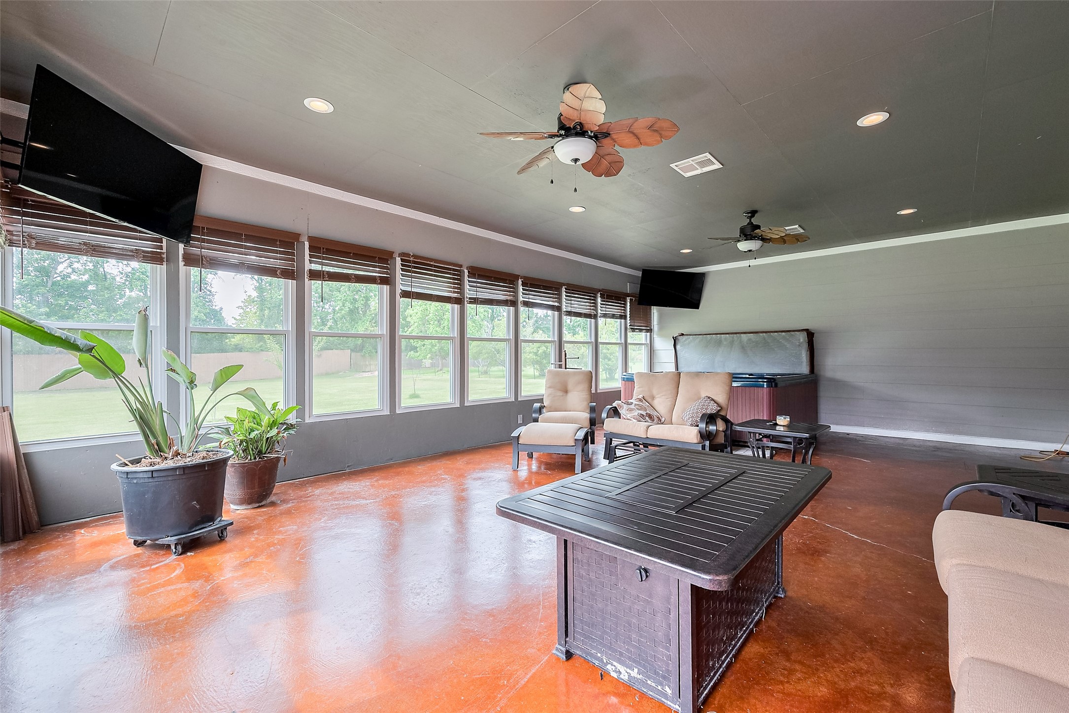 2499 Southline Road Conroe, TX 77384 - Photo 42 of 48 a living room with furniture a flat screen tv and large windows