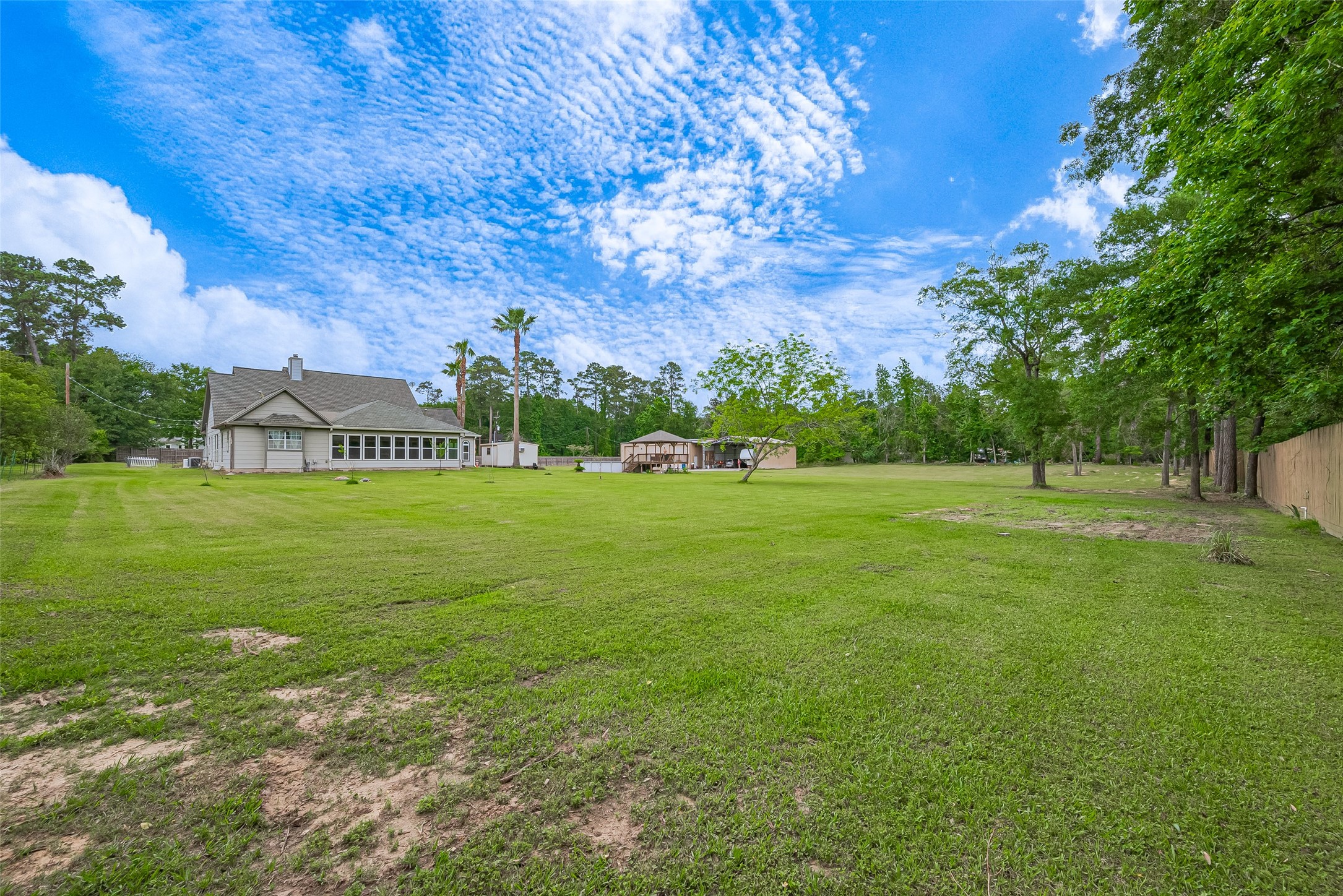 2499 Southline Road Conroe, TX 77384 - Photo 44 of 48 a view of a house with a big yard
