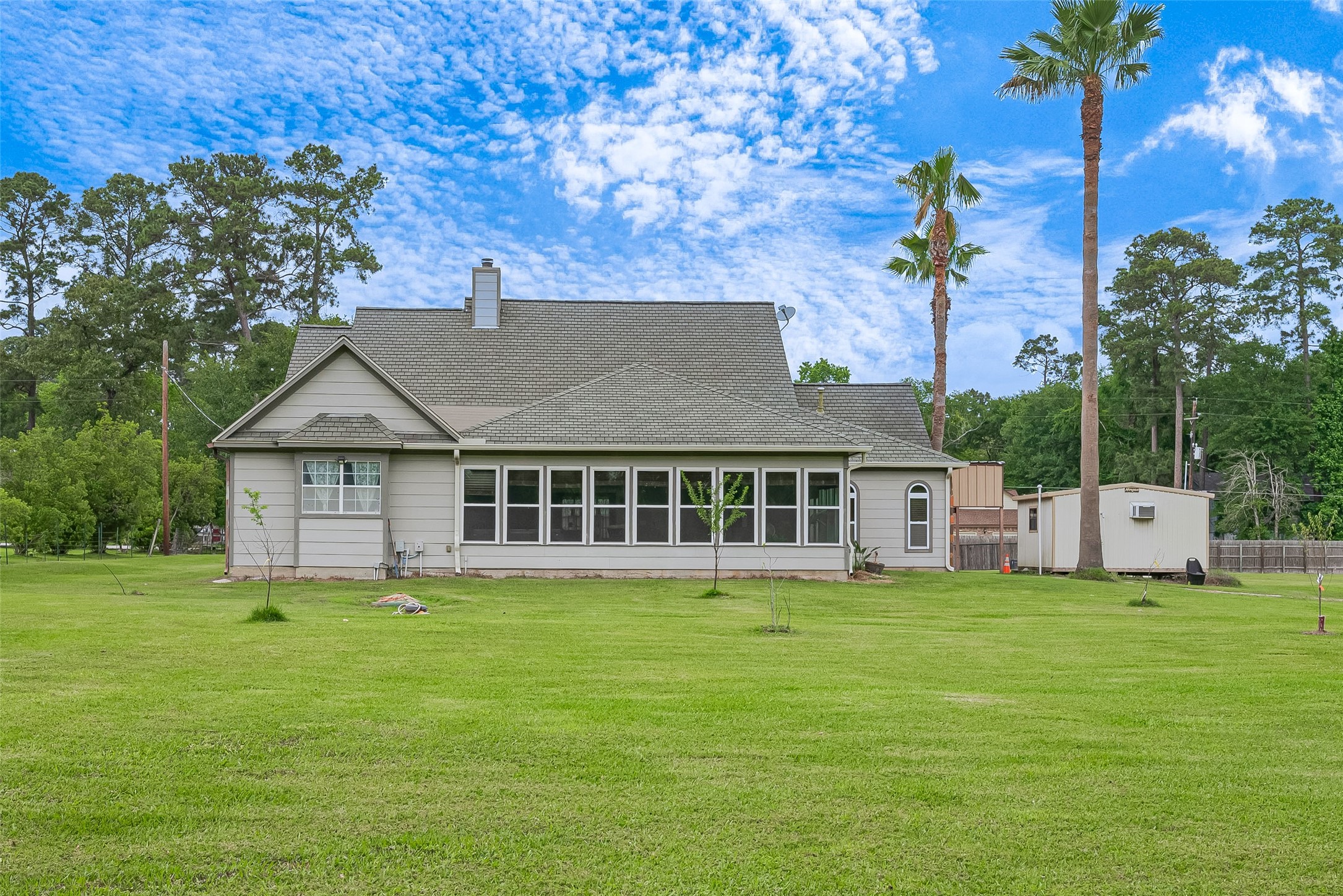 2499 Southline Road Conroe, TX 77384 - Photo 45 of 48 a view of a house with a yard and sitting area
