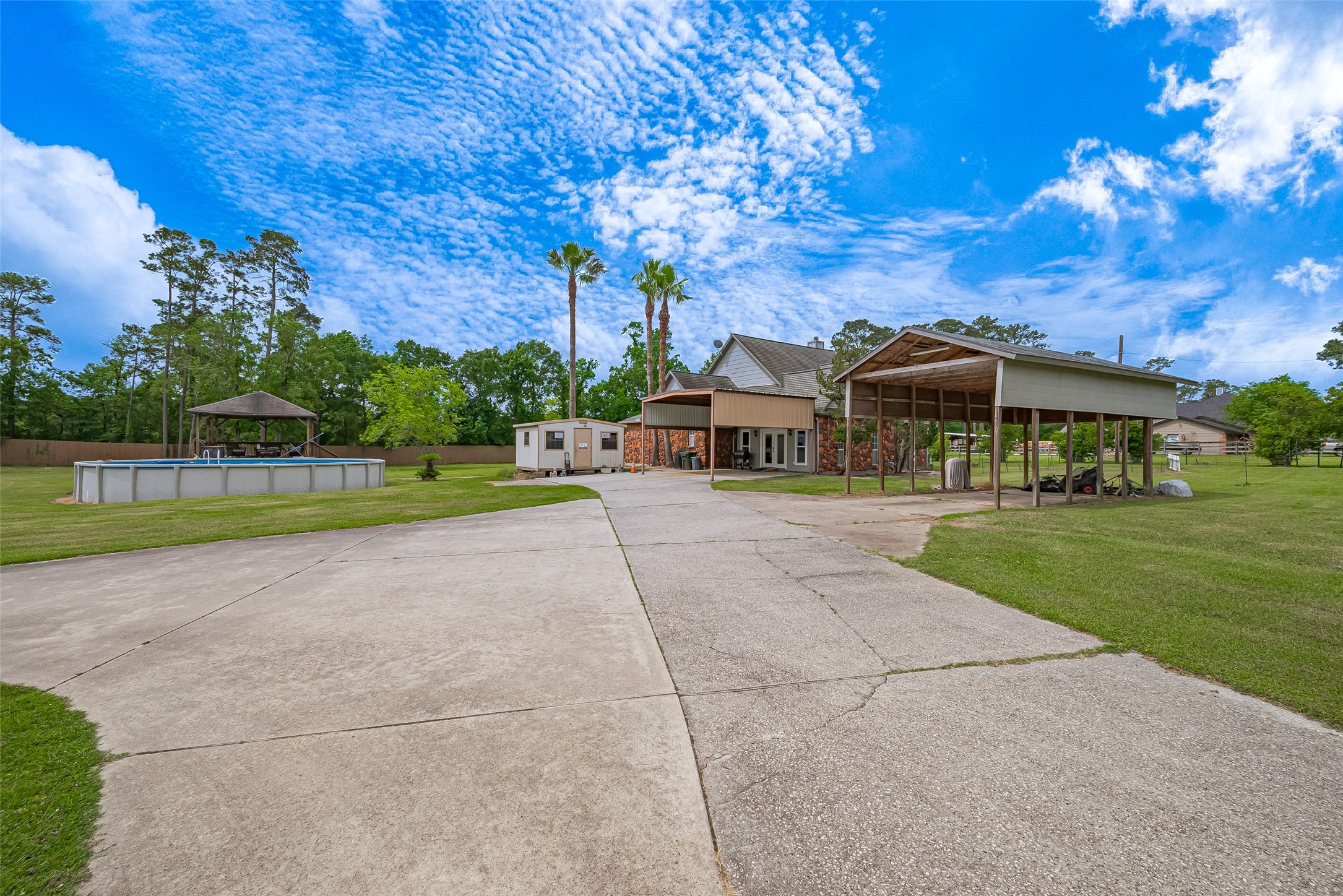 2499 Southline Road Conroe, TX 77384 - Photo 6 of 48 a view of a house with a swimming pool