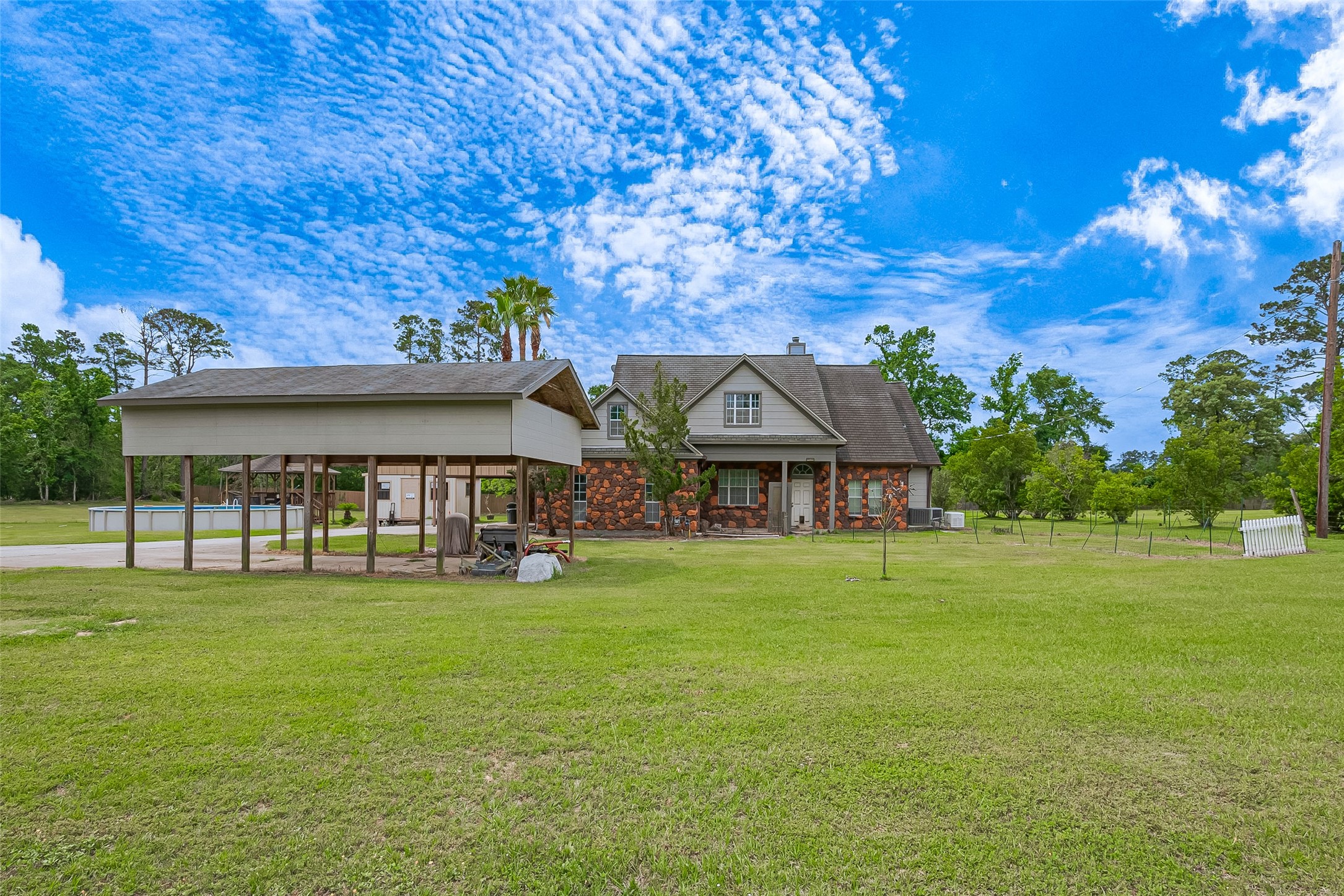 2499 Southline Road Conroe, TX 77384 - Photo 7 of 48 a front view of a house with a garden