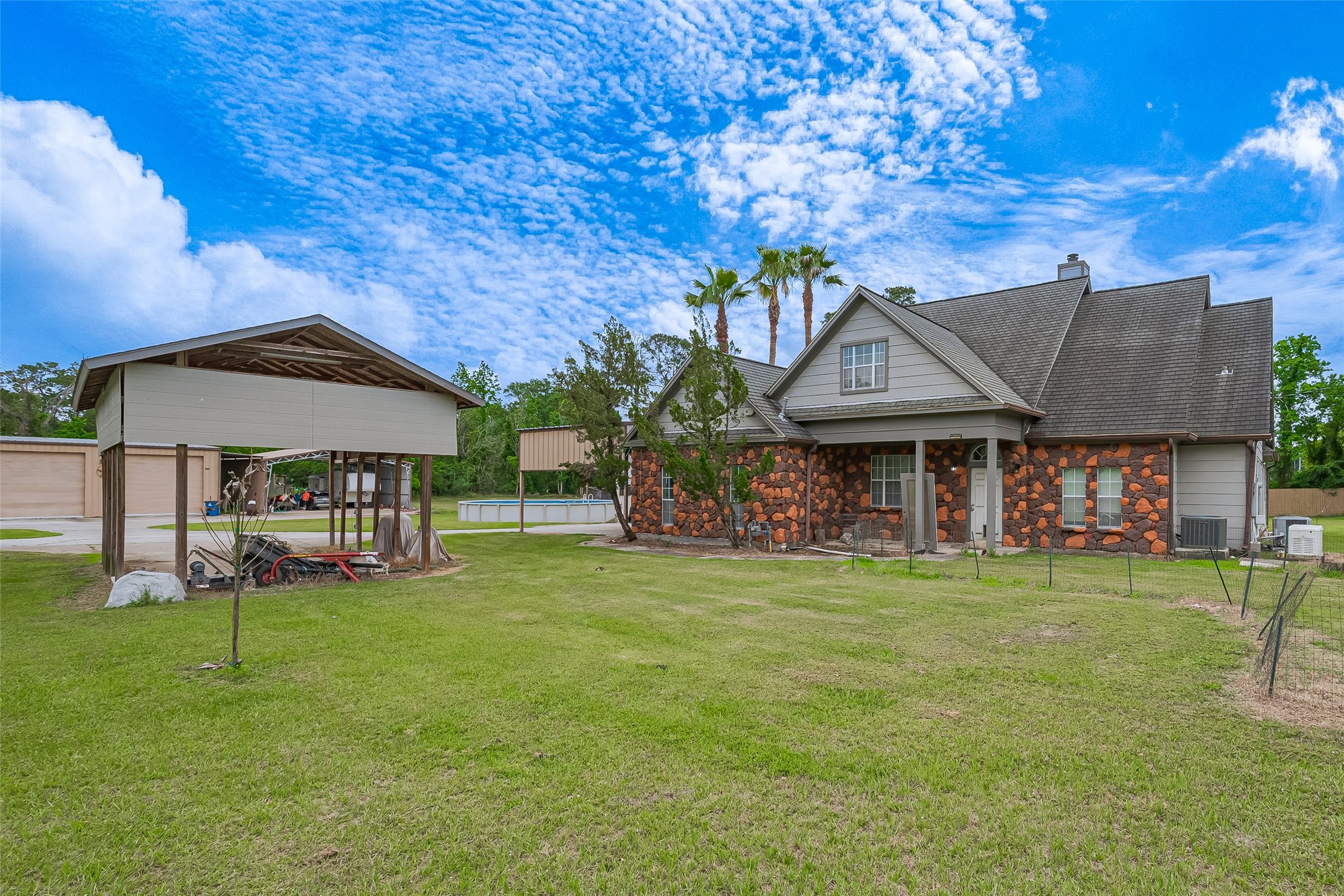 2499 Southline Road Conroe, TX 77384 - Photo 8 of 48 a front view of a house with a garden