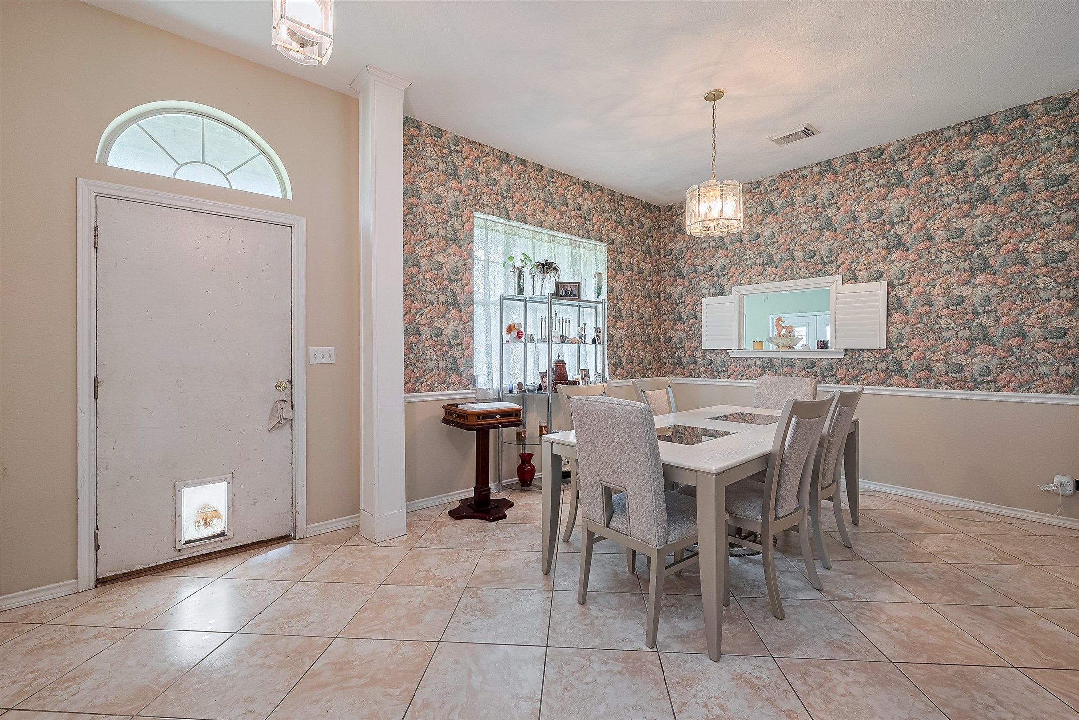 2499 Southline Road Conroe, TX 77384 - Photo 9 of 48 a view of a a dining room with furniture window and wooden floor