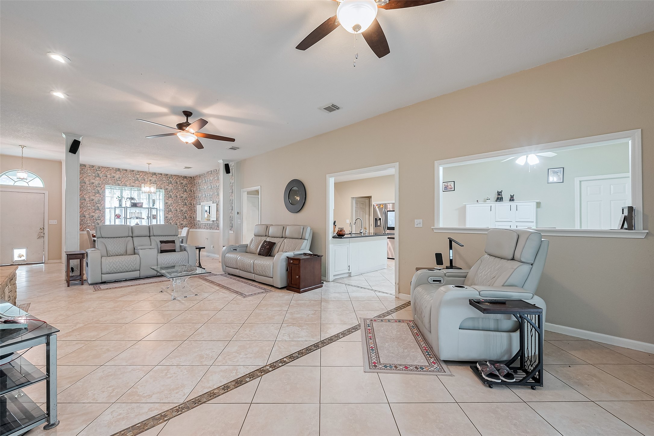 2499 Southline Road Conroe, TX 77384 - Photo 10 of 48 a living room with furniture and a chandelier
