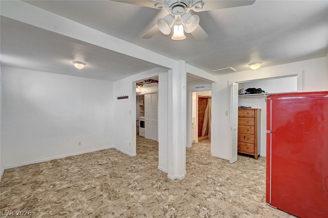 629 L Avenue Boulder City, NV 89005 - Photo 36 of 46 Basement room with ceiling fan and refrigerator