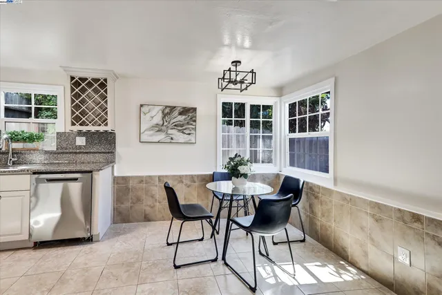 a kitchen with granite countertop a sink and cabinets
