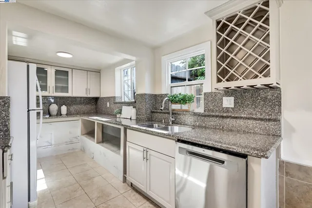 a bedroom with a large bed and a potted plant