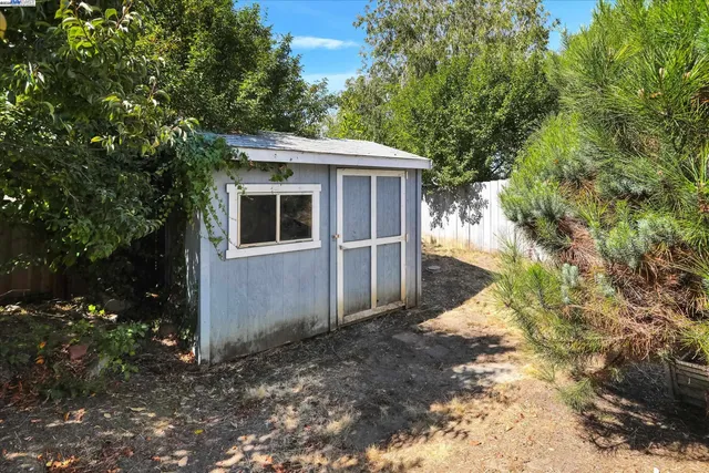a backyard of a house with yard and garage