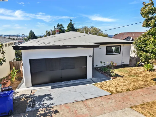an aerial view of a house with swimming pool