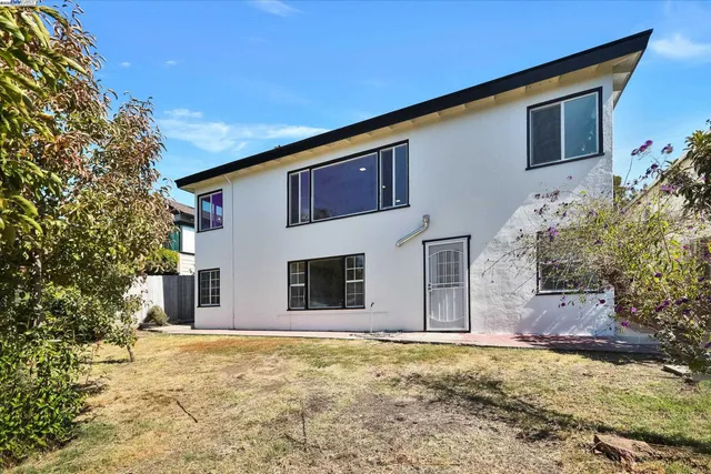 an aerial view of a house with a garden and plants