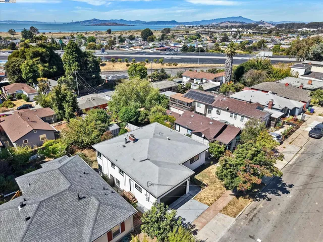 an aerial view of residential houses with outdoor space