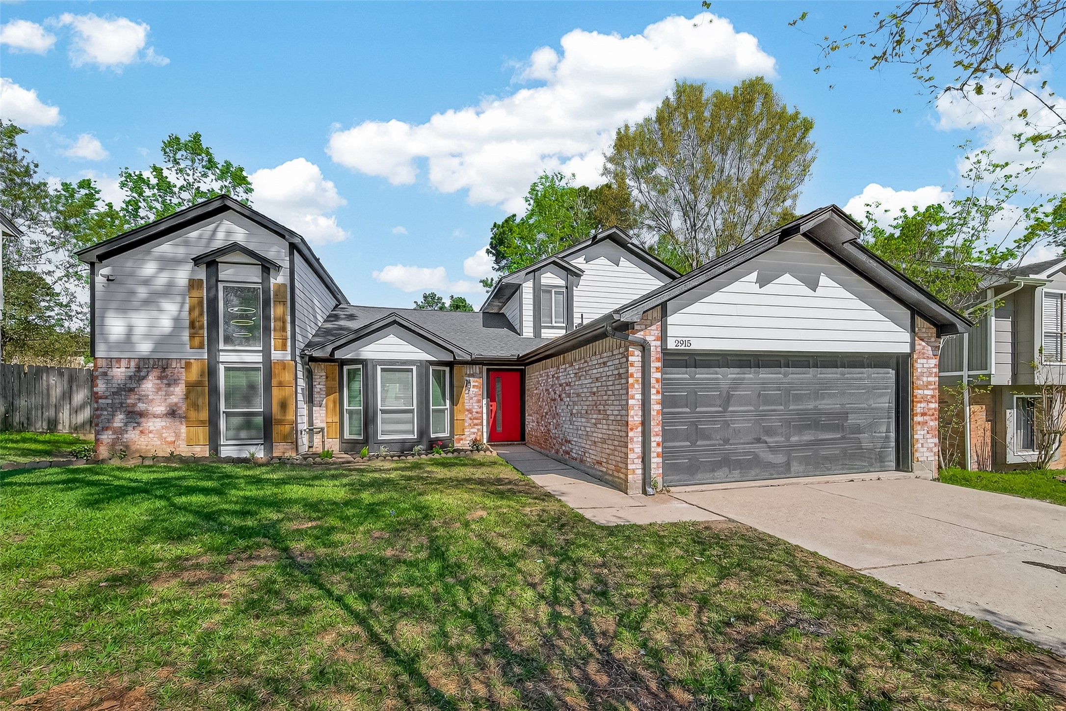 2915 Whispering Springs Drive Spring, TX 77373 - Photo 2 of 36 Stylish exterior with updated siding, brick accents, and a contemporary color palette that stands out in the neighborhood.
