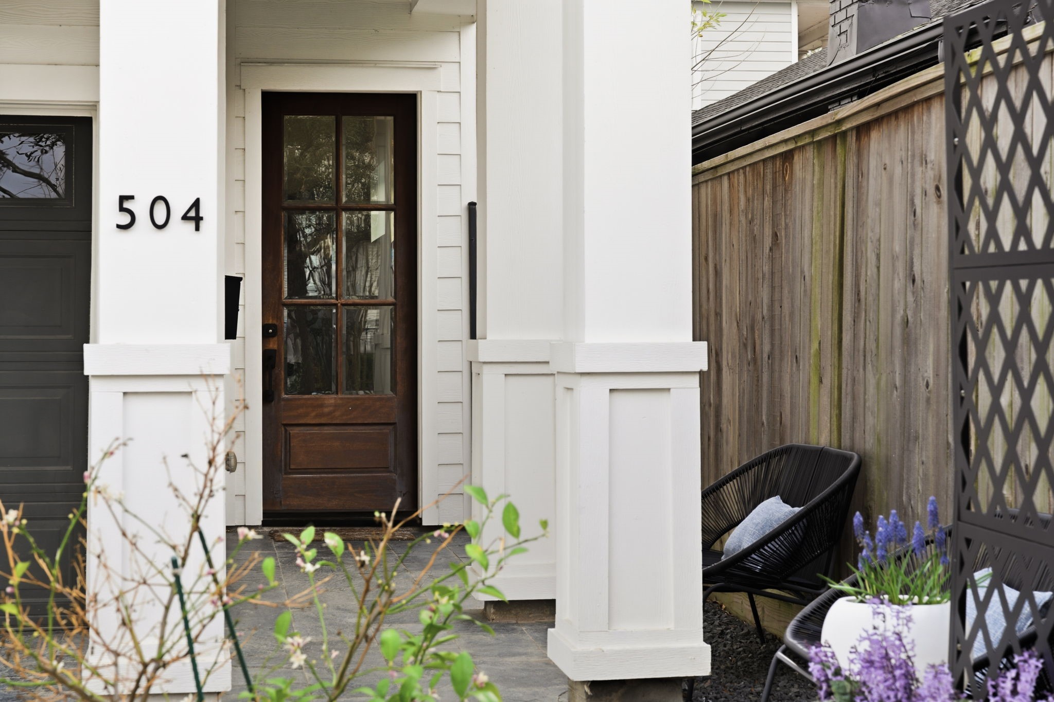 504 Oxford Street Houston, TX 77007 - Photo 2 of 47 A covered front entry creates a welcoming sense of privacy from the street. The wood front door and classic trim details add warmth and character before you even step inside. It’s a thoughtful introduction to the modern design carried throughout the home.