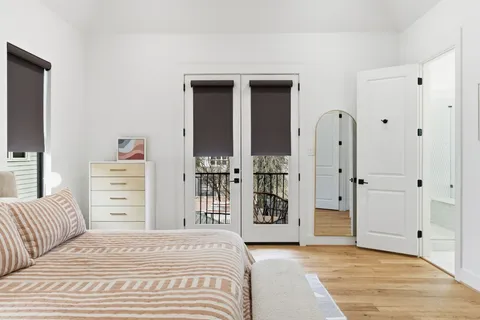 a bathroom with a white bath tub and shower