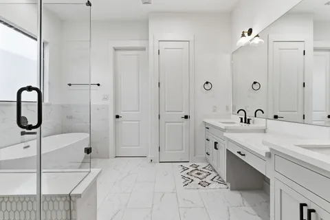 a bathroom with a sink vanity and mirror