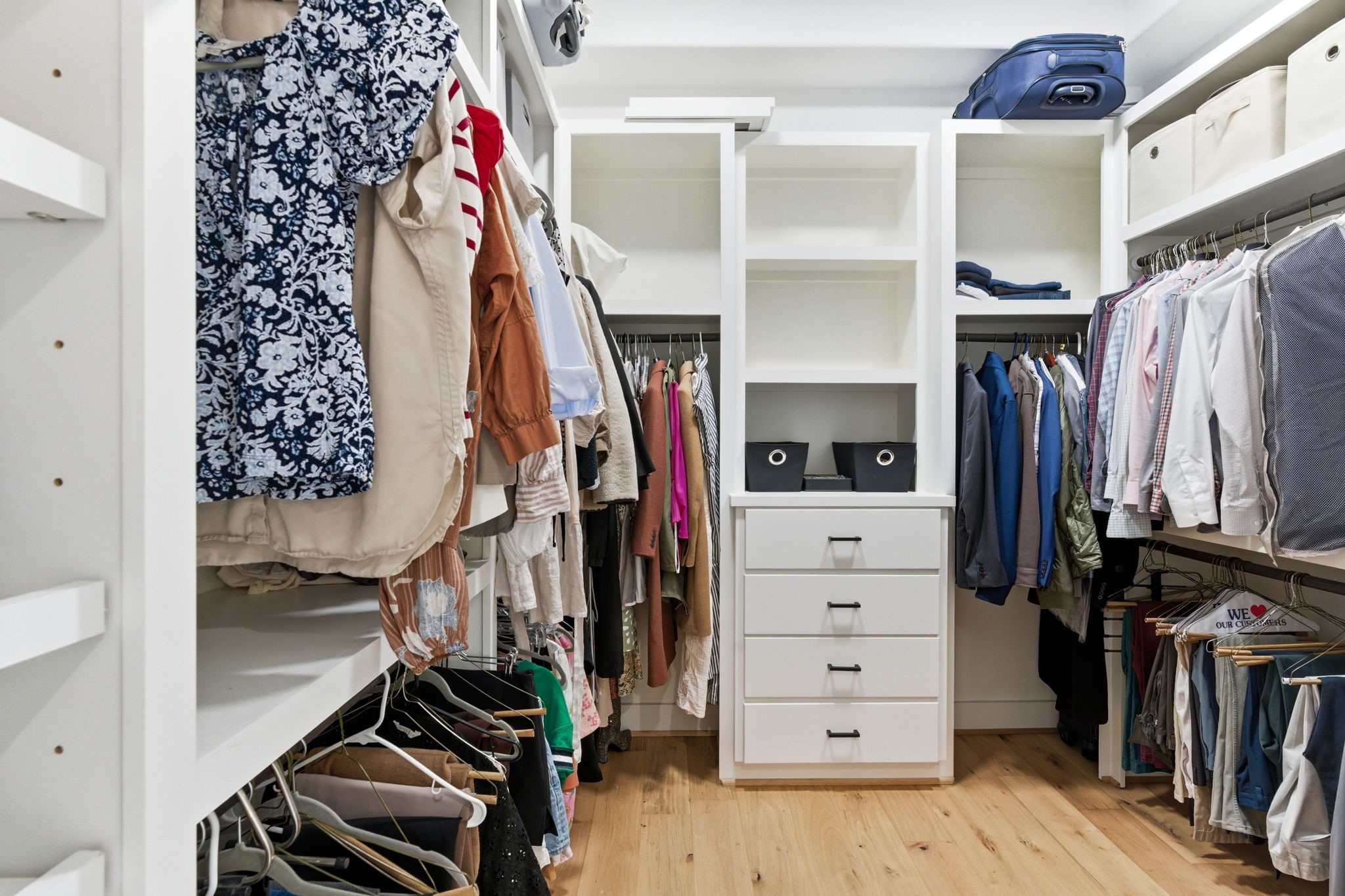 504 Oxford Street Houston, TX 77007 - Photo 31 of 47 The primary closet is fully built out with custom shelving, drawers, and double hanging space for effortless organization. Open cubbies and dedicated storage keep everything easily accessible. It’s a functional extension of the primary bedroom.