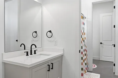 a bedroom with furniture and a rug