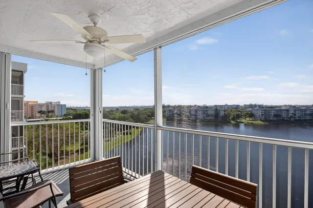 a view of a balcony with wooden floor
