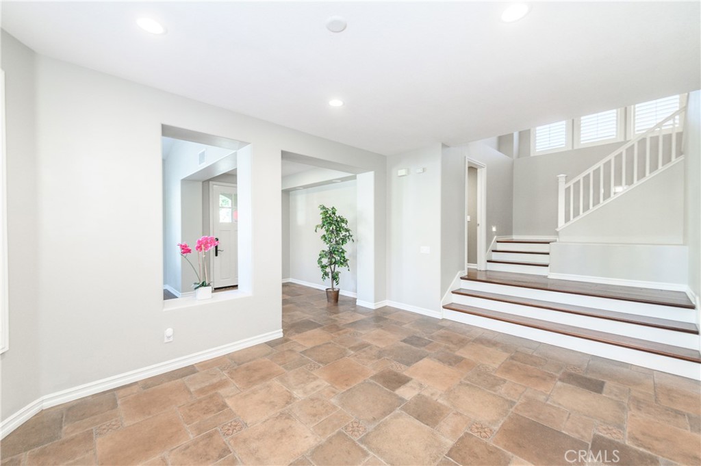 2 Bayleaf Lane Irvine, CA 92620 - Photo 13 of 40 a view of a hallway with wooden floor and a chandelier
