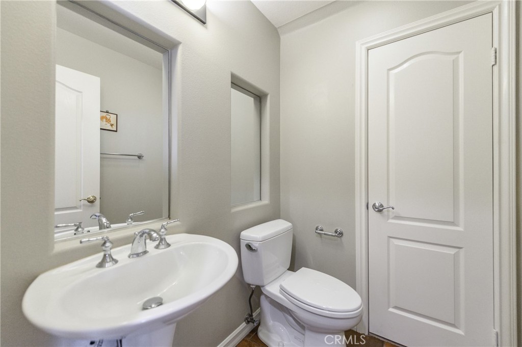 2 Bayleaf Lane Irvine, CA 92620 - Photo 14 of 40 a bathroom with a sink a toilet and a mirror