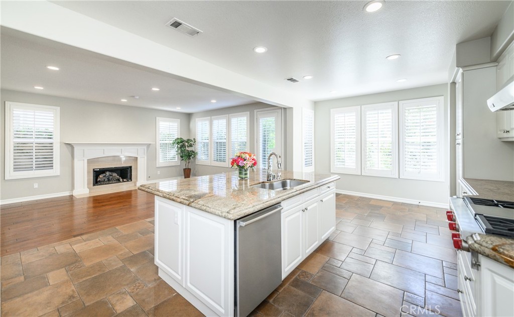 2 Bayleaf Lane Irvine, CA 92620 - Photo 24 of 40 a kitchen with granite countertop a sink and cabinets