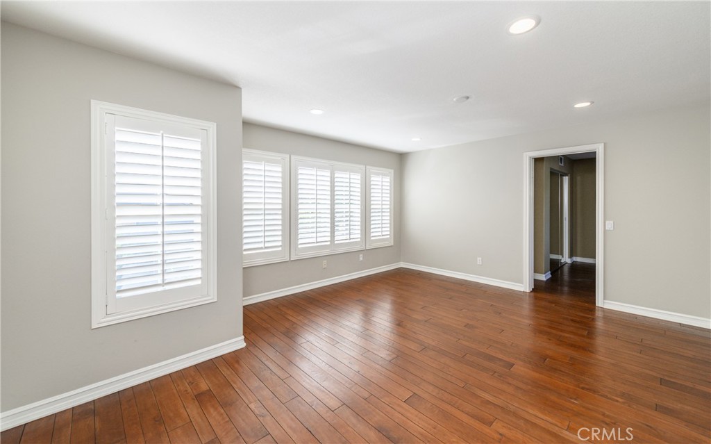 2 Bayleaf Lane Irvine, CA 92620 - Photo 33 of 40 an empty room with wooden floor and windows